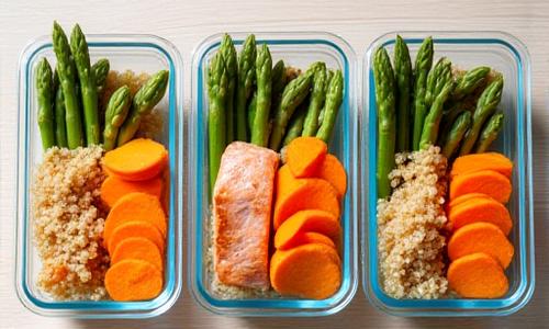 Organized glass containers with colorful healthy meals